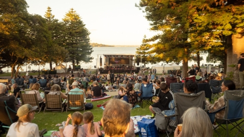 Crowd gathered at Dyoondalup Point Walter watching a stage at sunset for Nitja 