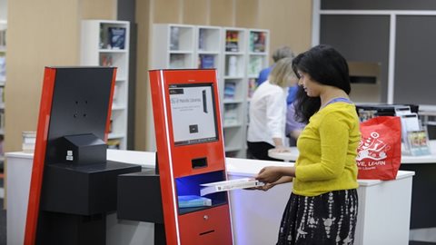 Library-member-using-self-checkout.jpg