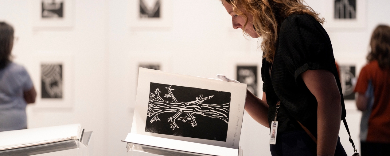 Exhibition featuring artwork and stories from Write Club book - In The Beginning, photograph by Hugh Sando